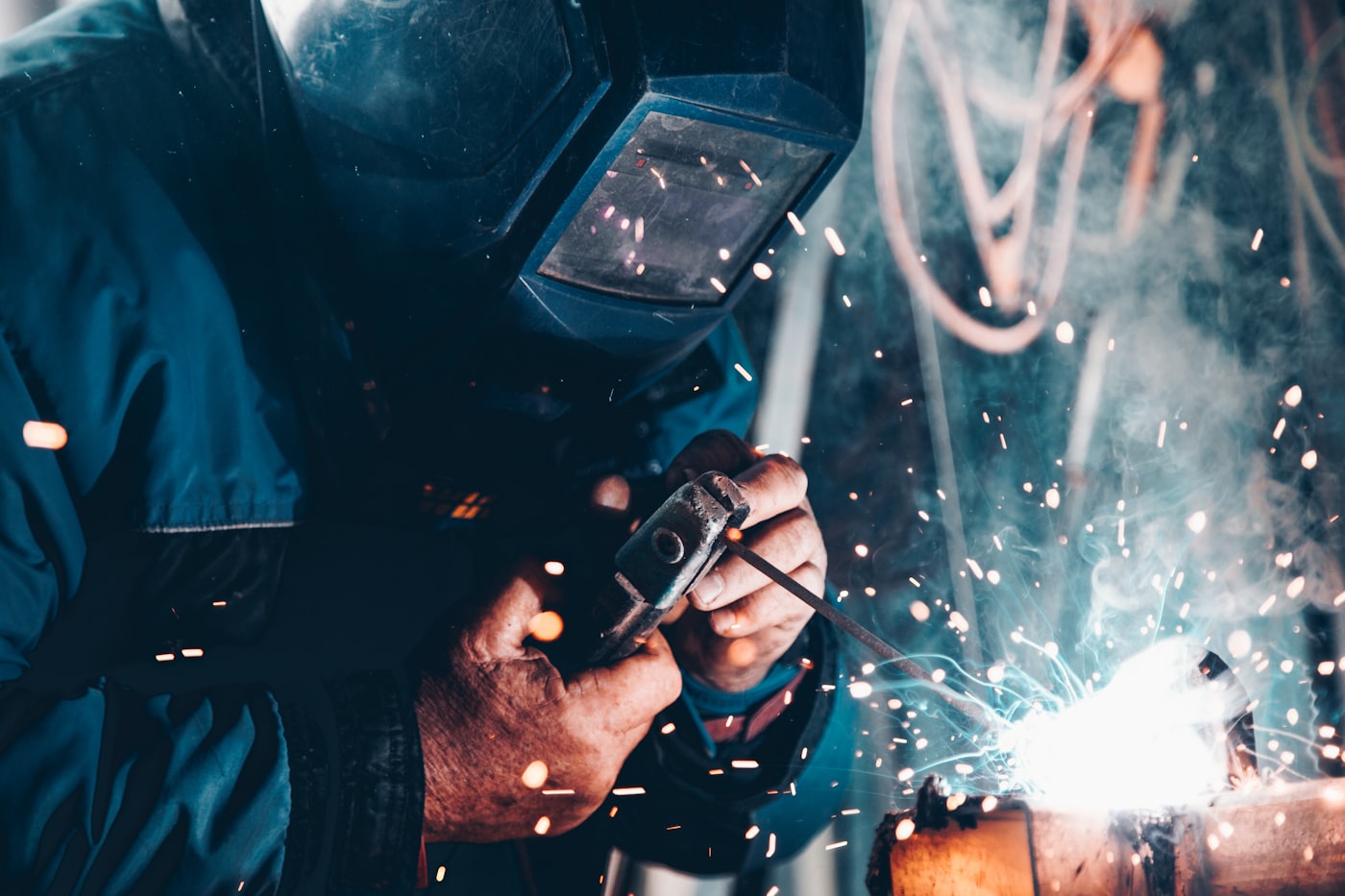 Welder working on a precision metal component